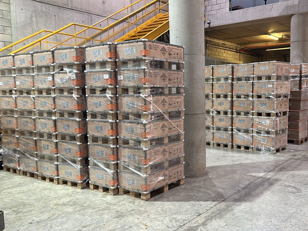 Palletised battery and inverter stock stored on the GreenWise warehouse floor in Beirut